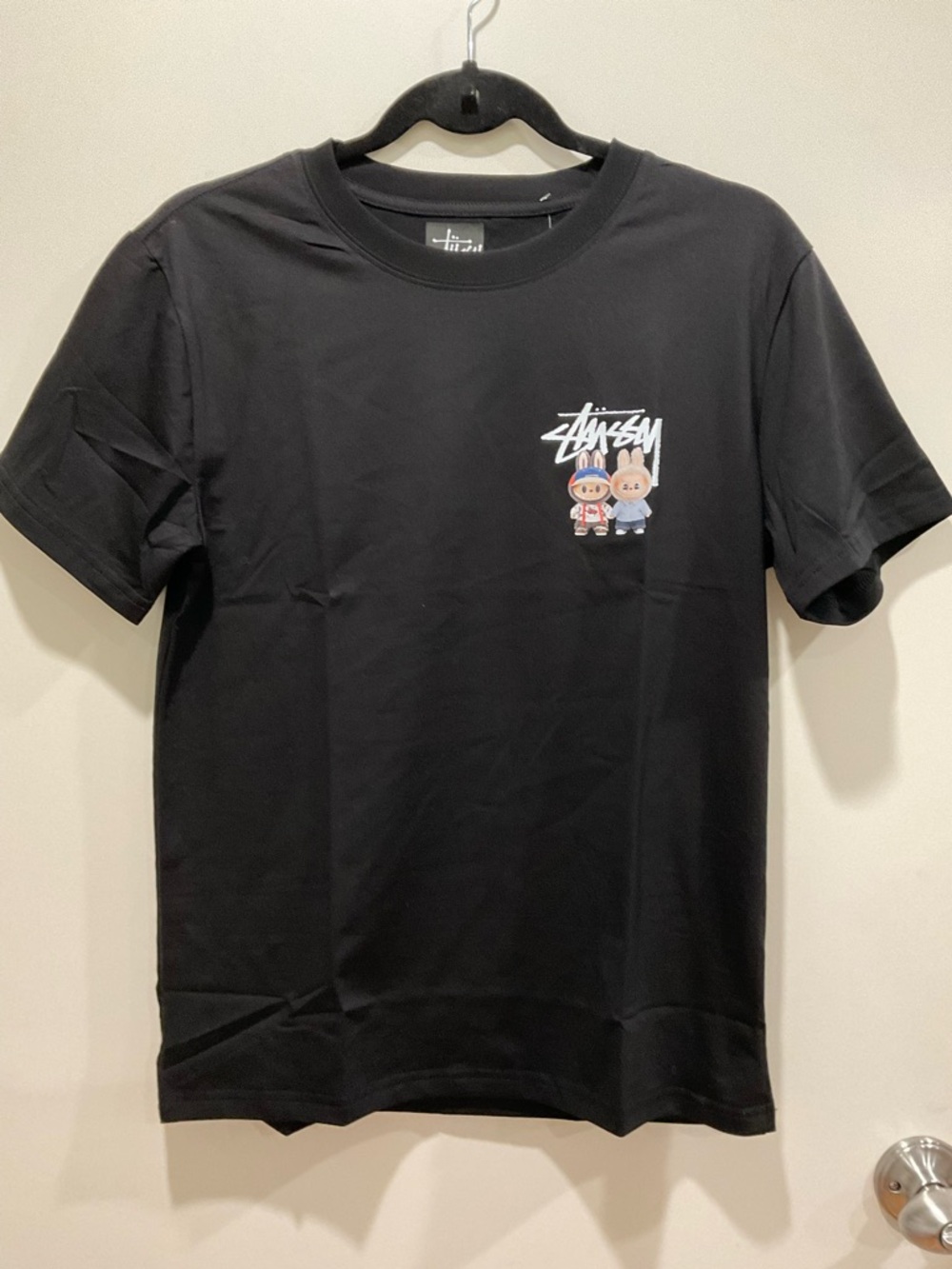 Stussy Black Short Sleeve Tee with Small Multicolor Graphic